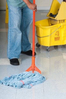 Reliable Commercial Cleaning LLC janitor in Saint Joseph, MN mopping floor.